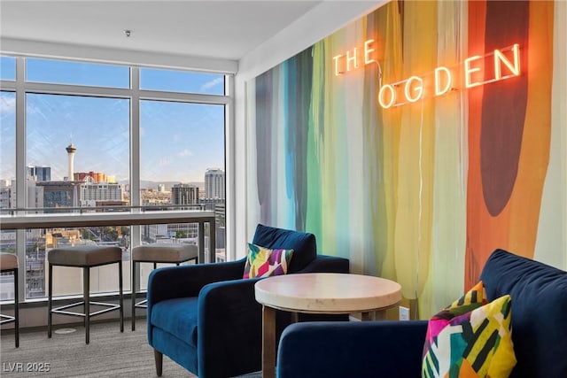 150 Las Vegas Blvd Unit 1711, Las Vegas, NV 89101 - living area featuring a city view, plenty of natural light, carpet flooring, and expansive windows