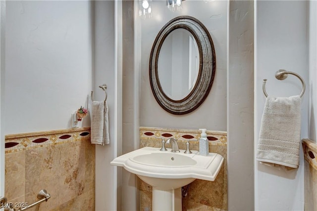 bathroom with tile walls