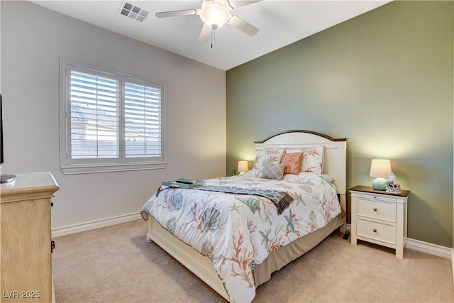 bedroom featuring visible vents, baseboards, light colored carpet, and ceiling fan