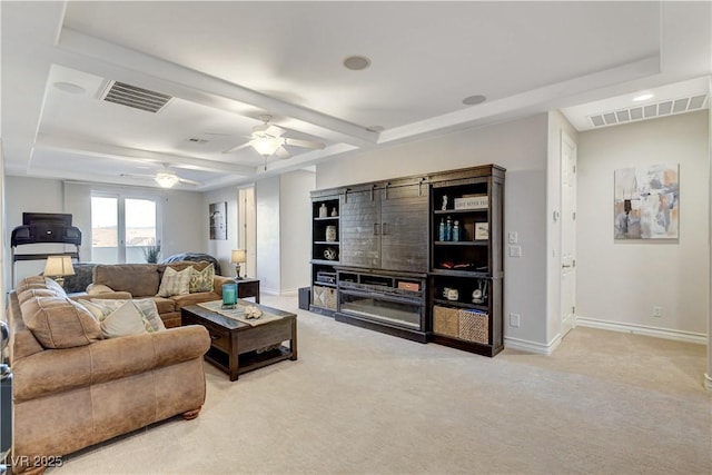 living room with baseboards, visible vents, and light carpet