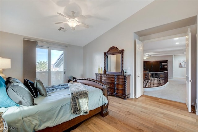 bedroom with access to exterior, visible vents, ceiling fan, lofted ceiling, and light wood-style floors