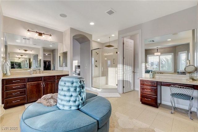 bathroom featuring tile patterned flooring, visible vents, a shower stall, recessed lighting, and vanity