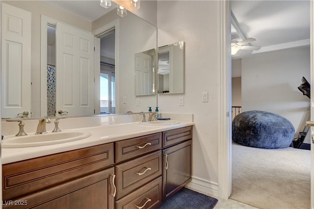 full bath featuring a sink, ceiling fan, and double vanity