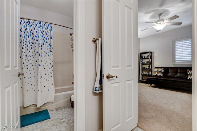 full bathroom with shower / bath combo and a ceiling fan