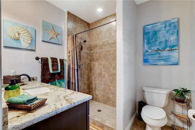 full bathroom with toilet, recessed lighting, tiled shower, baseboards, and vanity