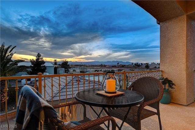 balcony at dusk with a mountain view