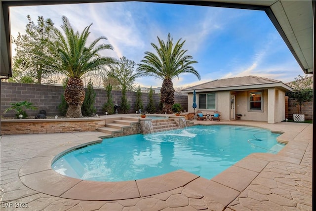 view of pool with an outbuilding, a patio, a fenced backyard, a fenced in pool, and an in ground hot tub