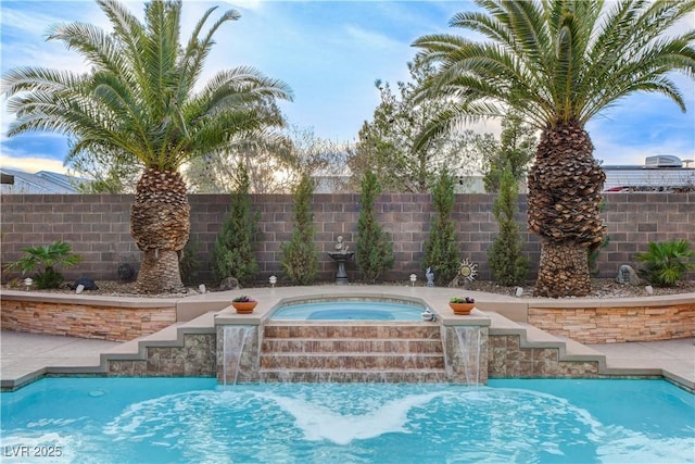 view of swimming pool with a fenced in pool, an in ground hot tub, and a fenced backyard