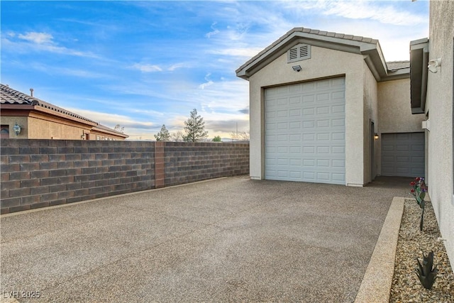 garage with fence