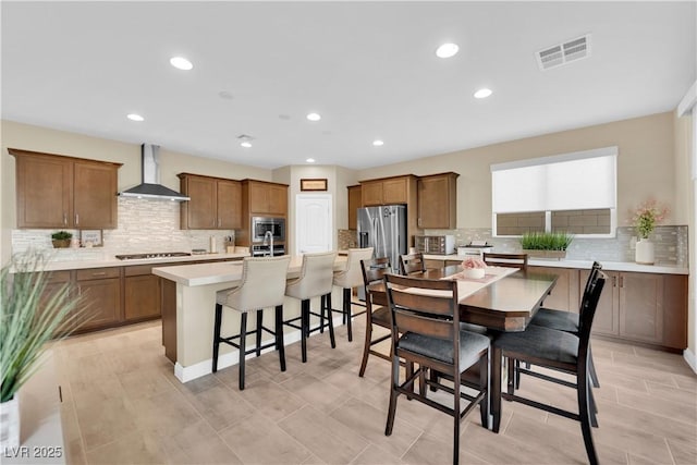 dining space featuring recessed lighting, visible vents, and a toaster