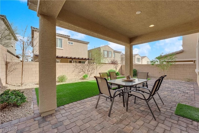 view of patio / terrace with outdoor dining space and a fenced backyard