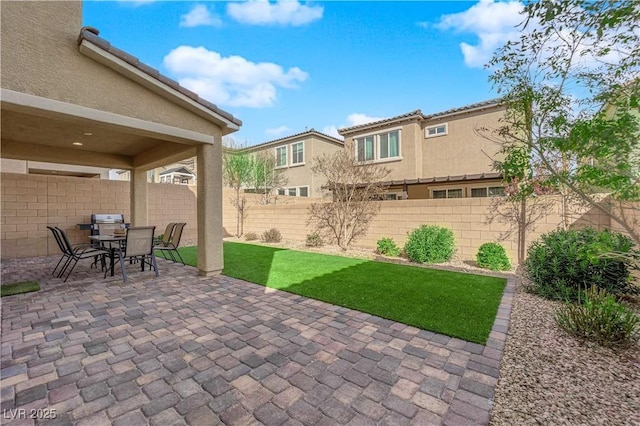 view of patio / terrace with a fenced backyard and outdoor dining space