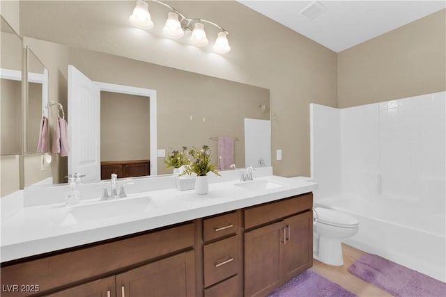 full bathroom with double vanity, visible vents, toilet, and a sink