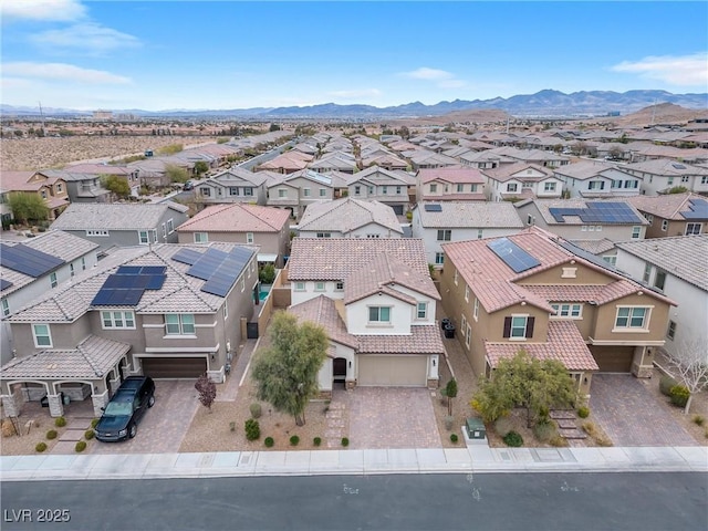 drone / aerial view featuring a residential view and a mountain view