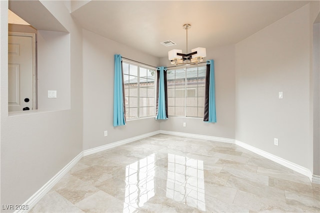 unfurnished room featuring a notable chandelier, visible vents, baseboards, and marble finish floor