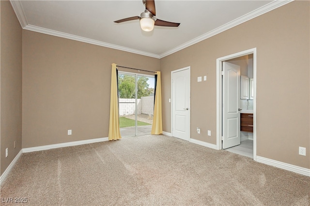 unfurnished room featuring light colored carpet, ceiling fan, baseboards, and ornamental molding