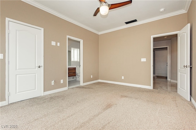 unfurnished bedroom featuring crown molding, baseboards, visible vents, and carpet floors