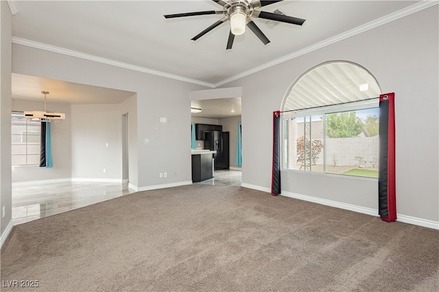 unfurnished living room with light colored carpet, a ceiling fan, baseboards, and ornamental molding