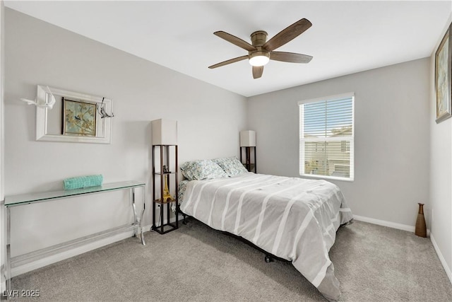 carpeted bedroom with baseboards and ceiling fan