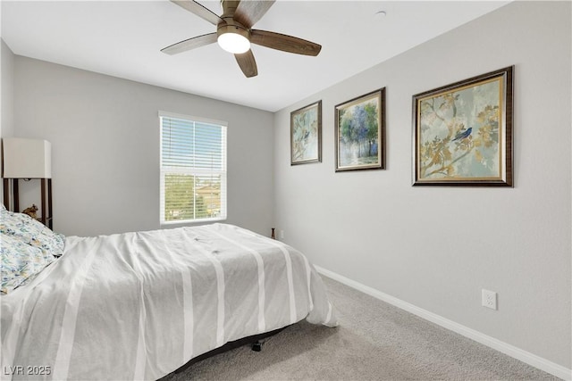 carpeted bedroom featuring a ceiling fan and baseboards