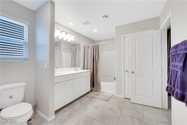 bathroom featuring visible vents, baseboards, toilet, tile patterned floors, and vanity