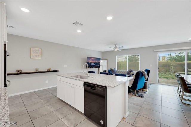 kitchen with visible vents, a sink, white cabinets, light tile patterned floors, and dishwasher