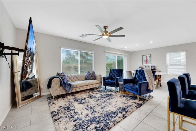 living room featuring visible vents, baseboards, light tile patterned floors, recessed lighting, and a ceiling fan