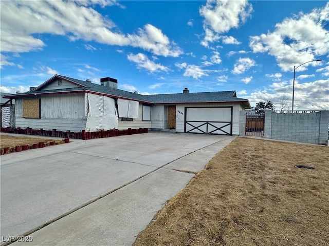 view of front of property with driveway and a garage