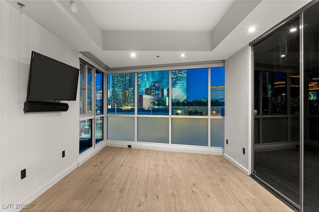 interior space with recessed lighting, baseboards, and wood finished floors