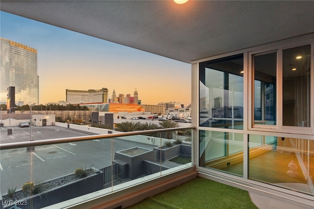 balcony at dusk with a city view