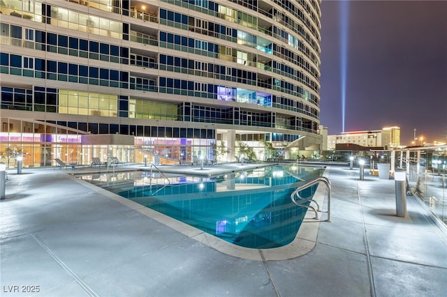 view of swimming pool featuring a view of city