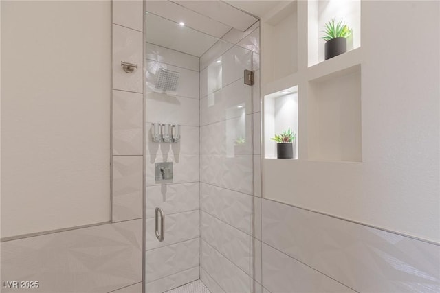 bathroom with a shower stall