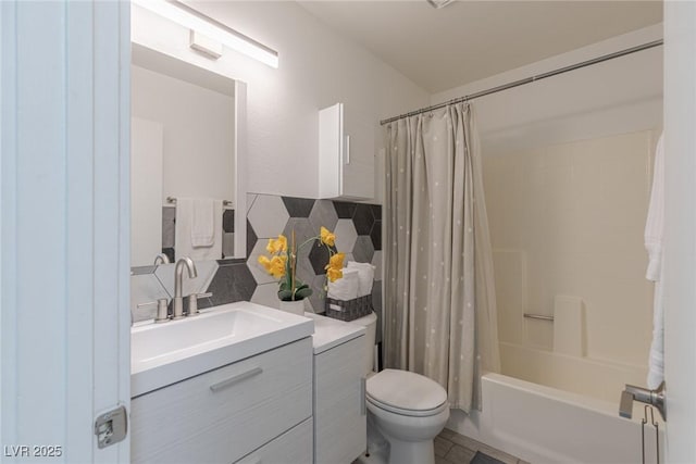 bathroom featuring tasteful backsplash, tile walls, toilet, shower / bath combo, and vanity