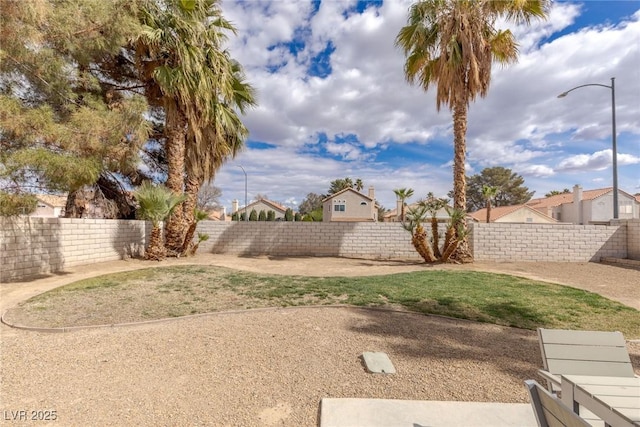 view of yard with a fenced backyard