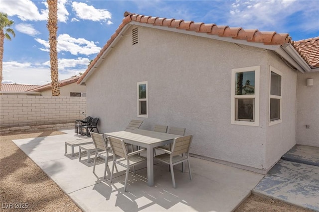 view of patio / terrace with outdoor dining area and fence