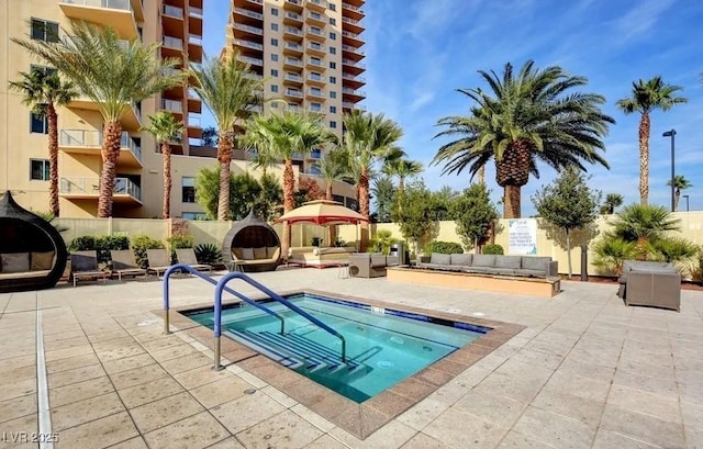 view of swimming pool featuring a patio and an outdoor hangout area