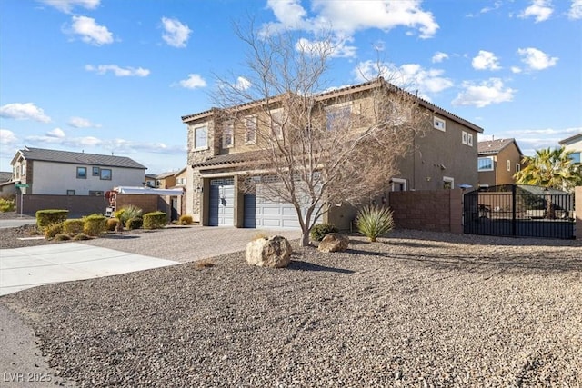 exterior space featuring stucco siding, a gate, decorative driveway, fence, and an attached garage