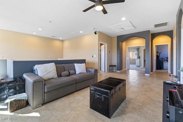 living room with recessed lighting, visible vents, arched walkways, and a ceiling fan