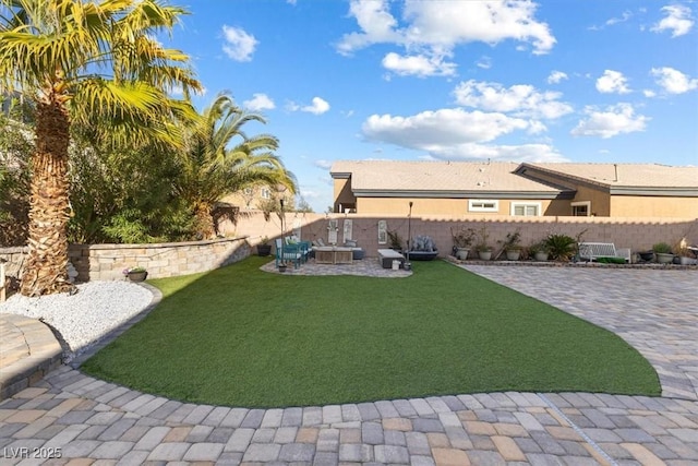 view of yard featuring a fenced backyard and a patio area