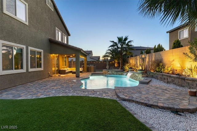 view of pool featuring a fenced in pool, a patio, a lawn, and a fenced backyard