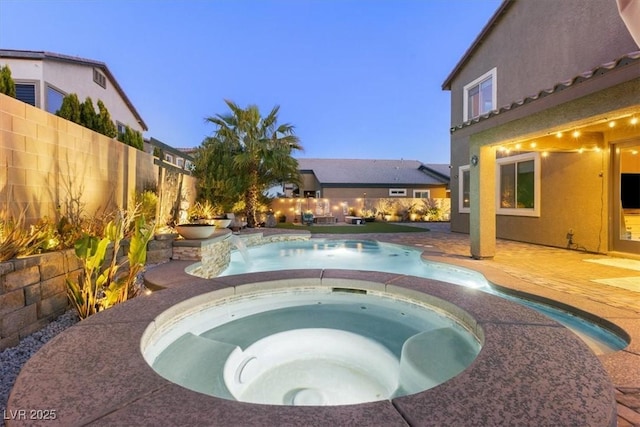 view of swimming pool featuring a fenced in pool, a patio, an in ground hot tub, and a fenced backyard