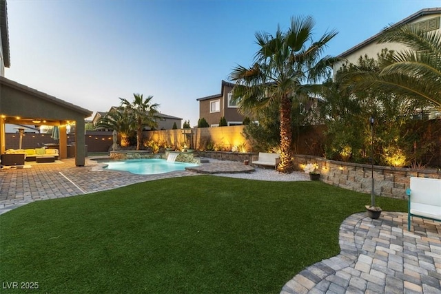 view of yard with outdoor lounge area, a patio area, a fenced backyard, and a fenced in pool