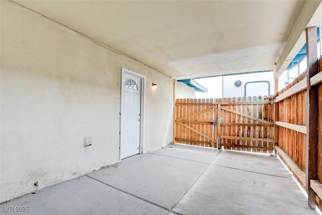 view of patio / terrace featuring fence and a gate