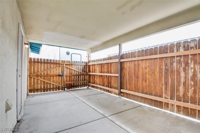 view of patio featuring fence