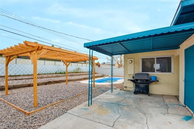 view of patio featuring fence, a pergola, and grilling area