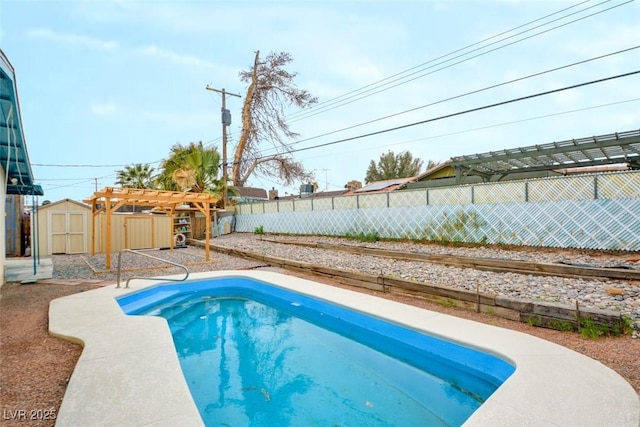 view of pool featuring an outbuilding, a fenced in pool, a shed, a fenced backyard, and a pergola