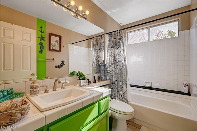 full bathroom featuring vanity, tile patterned floors, toilet, and shower / tub combo with curtain