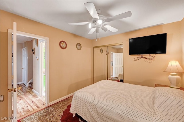 bedroom with baseboards, a closet, and ceiling fan