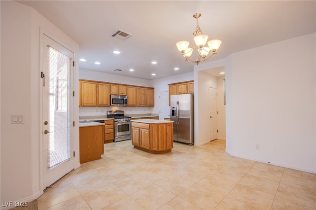 kitchen with visible vents, a center island, light countertops, recessed lighting, and appliances with stainless steel finishes