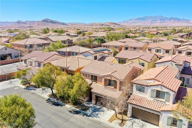 aerial view featuring a mountain view and a residential view